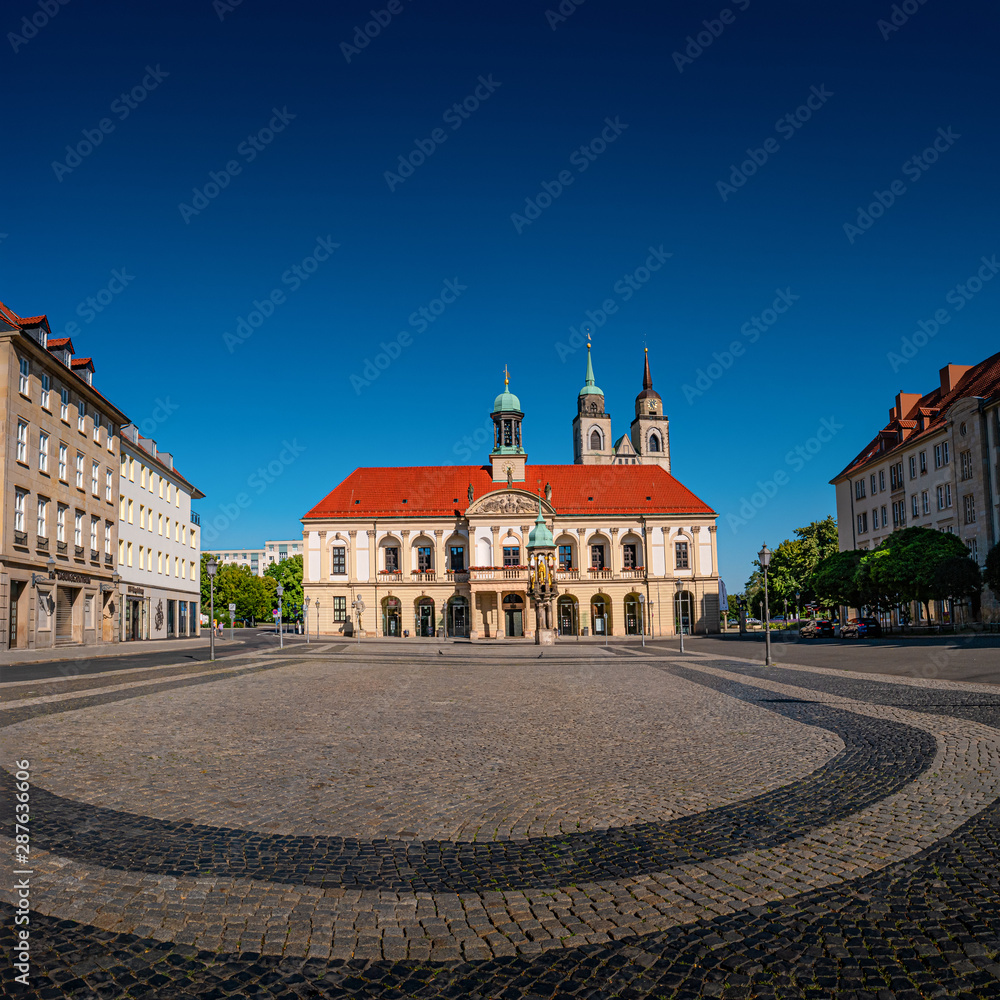 Panoramic view at City Hall (Rathaus), Golden Equestrian statue of Magdeburger Reiter and Alter Markt Square in Magdeburg at blue sky and sunny day, Germany
