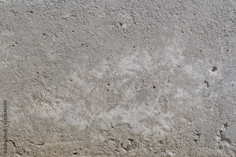 Old gray concrete wall with yellow and brown spots as an abstract background Old gray concrete wall with yellow and brown spots as an abstract background
