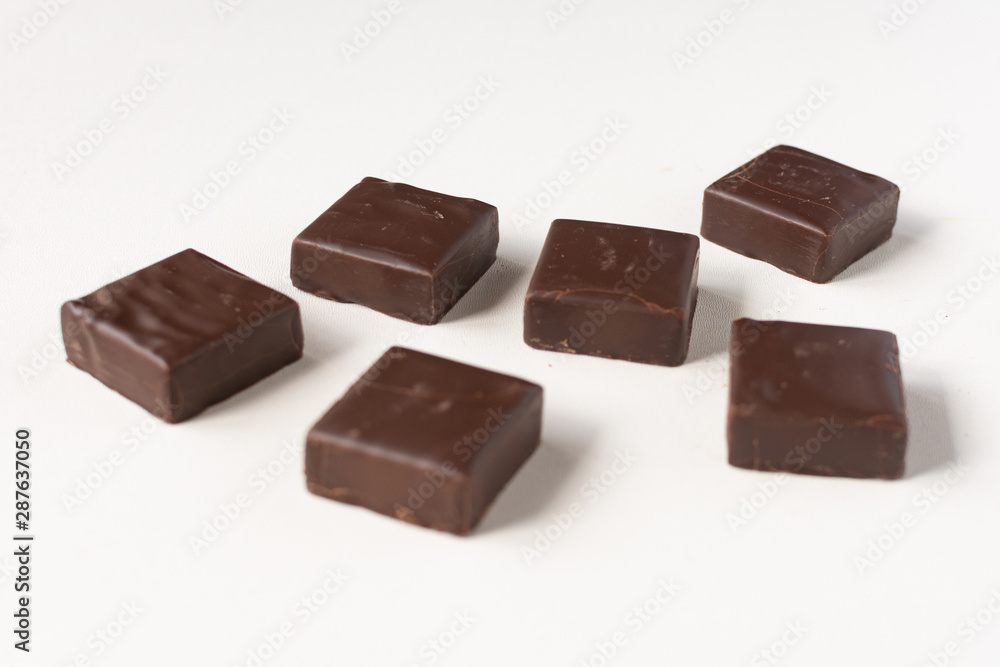 Chocolate candies on a white background. Chocolate candies on a white background.