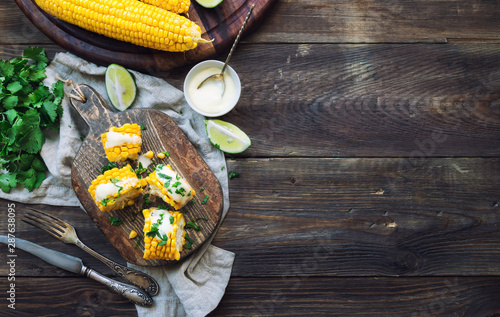 Canvas Print Baked corn cobs with aioli sauce and cilantro