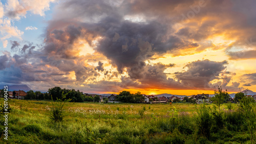 Background with dramatic clouds at sunset after storm