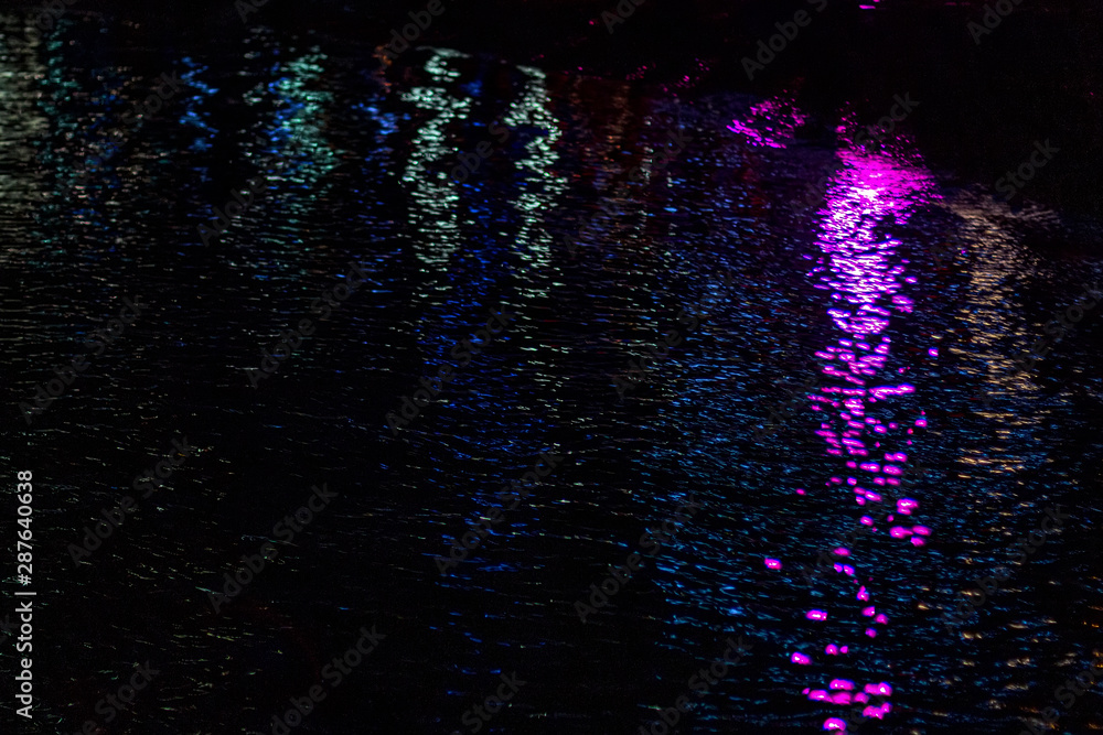 Reflection of multi-colored lights on the water