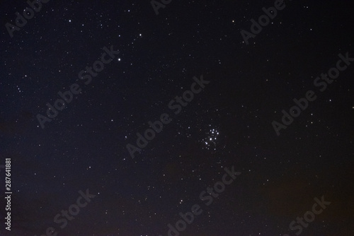 Stars in the night sky through the clouds © dmitriydanilov62