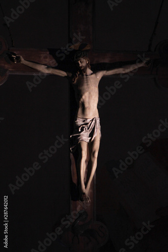 Old medieval crucifix in Italian church - made of wood © Giordano