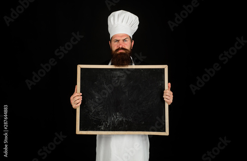 Canvas Print Restaurant chef showing menu blackboard sign
