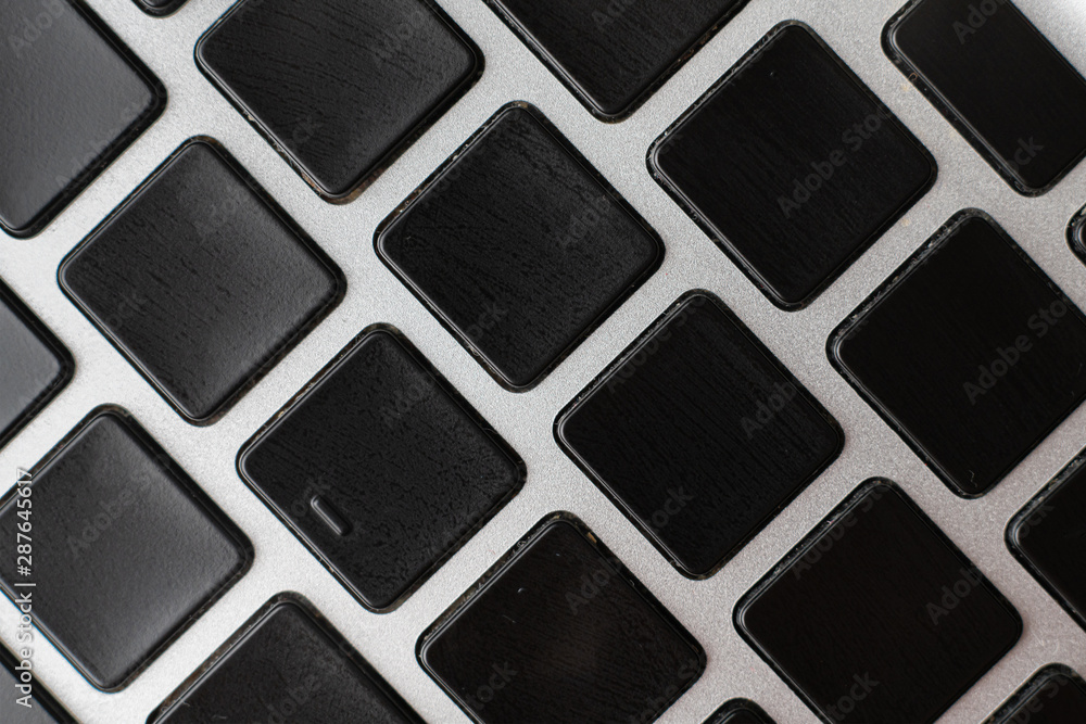 macro shot of empty blank keys on a keyboard without letters macro shot of empty blank keys on a keyboard without letters