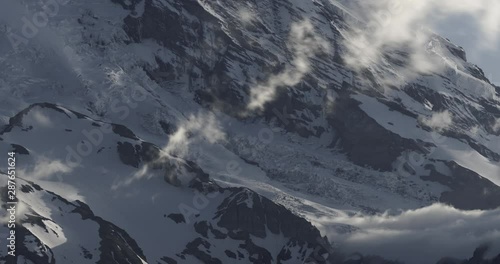 4K Timelapse of Dramatic Storm and Mist on Mount Rainier at Sunset