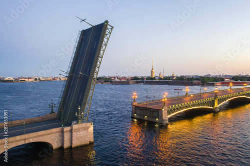 Petersburg Russia. The cargo ship passes under the bridge. Petersburg bridges. Trinity Bridge. White nights in Petersburg. Cities of Russia.