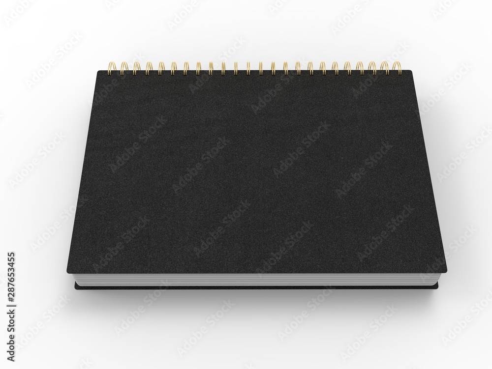 Black notebook with golden spiral binding and leather covers - top down side view Black notebook with golden spiral binding and leather covers - top down side view
