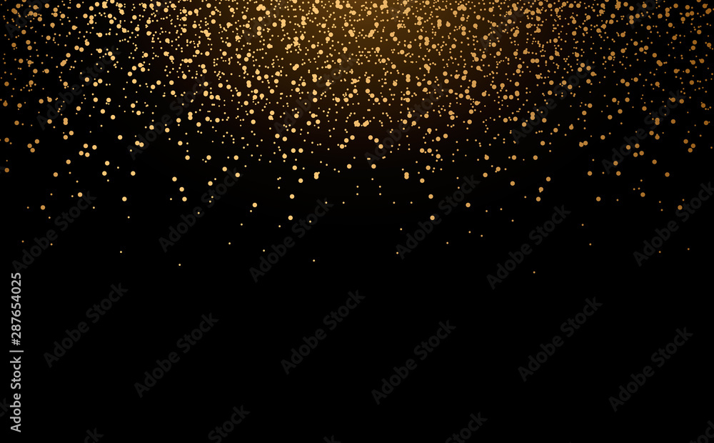 Golden scattered dust powder falling from above with shine on a black background.