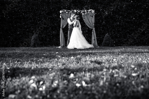 couple in love at the ceremony.black and white wedding photos