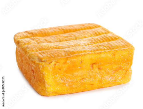 Block of tasty munster cheese isolated on white