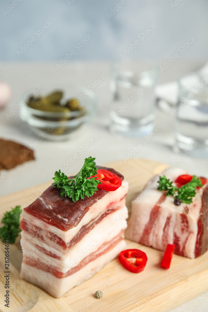 Composition with bacon and chili pepper on table against blue background. Space for text Composition with bacon and chili pepper on table against blue background. Space for text