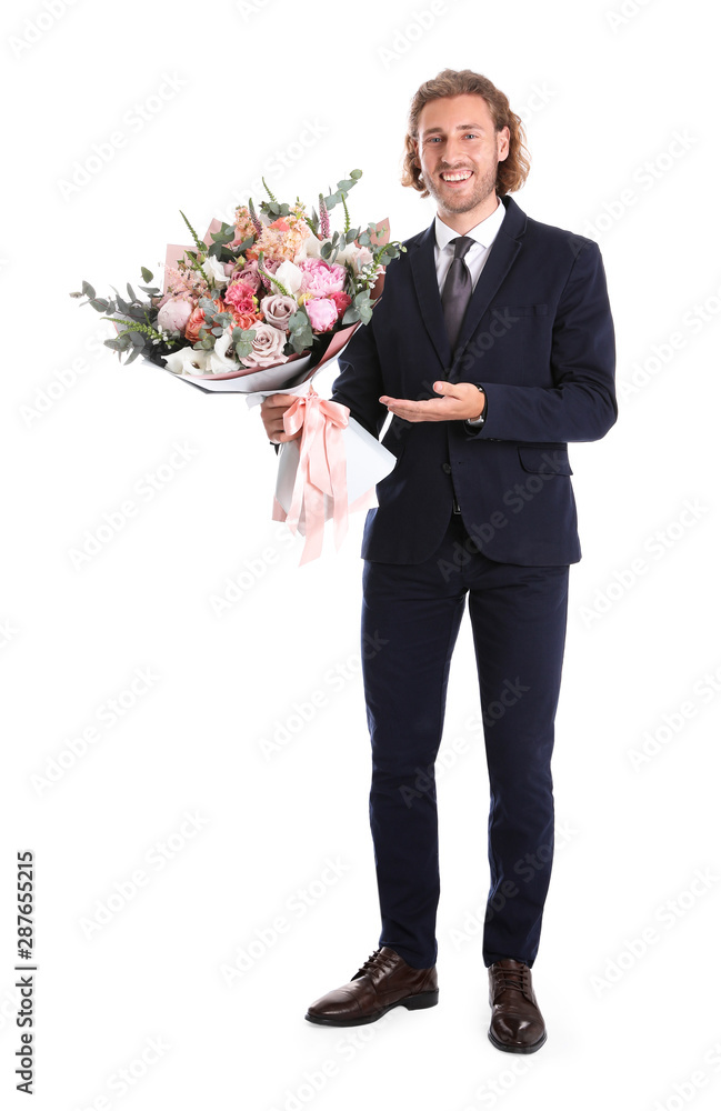 Young handsome man in stylish suit with beautiful flower bouquet on white background Young handsome man in stylish suit with beautiful flower bouquet on white background