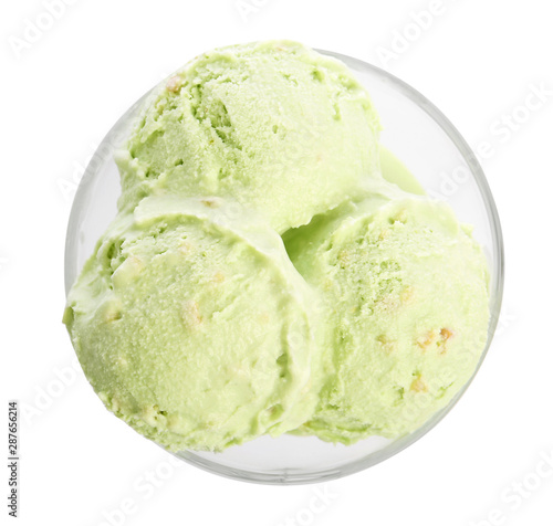 Dishware of sweet pistachio ice cream on white background, top view