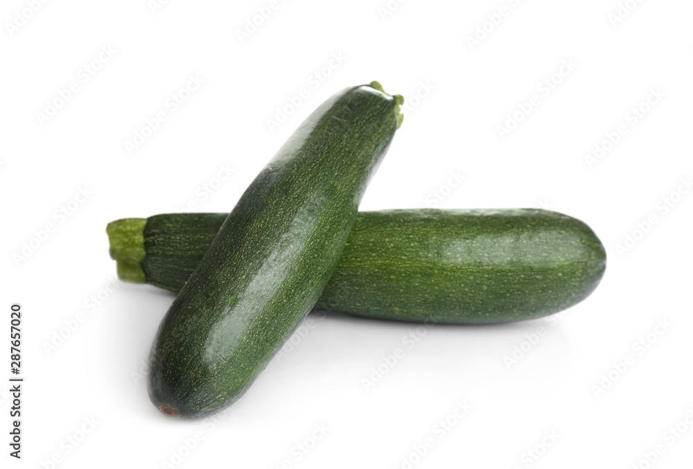 Fresh ripe green zucchinis isolated on white Fresh ripe green zucchinis isolated on white