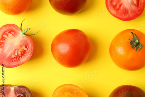 Fototapeta Naklejka Na Ścianę i Meble -  Flat lay composition with fresh ripe tomatoes on yellow background