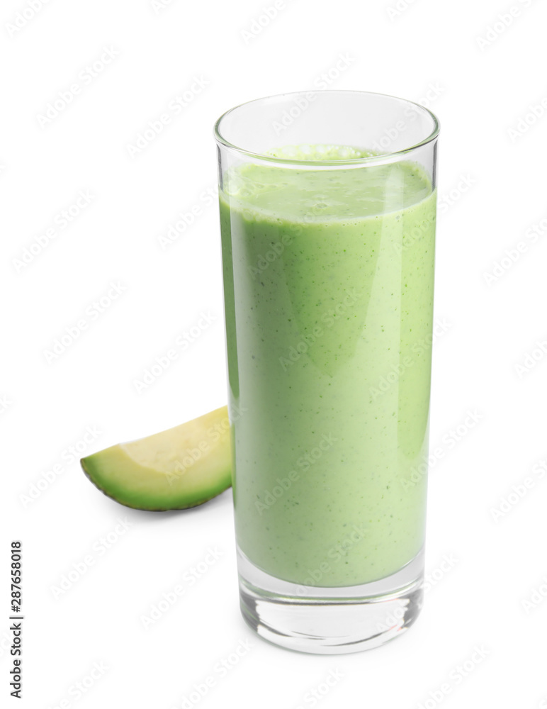 Glass of tasty smoothie and avocado slice on white background Glass of tasty smoothie and avocado slice on white background