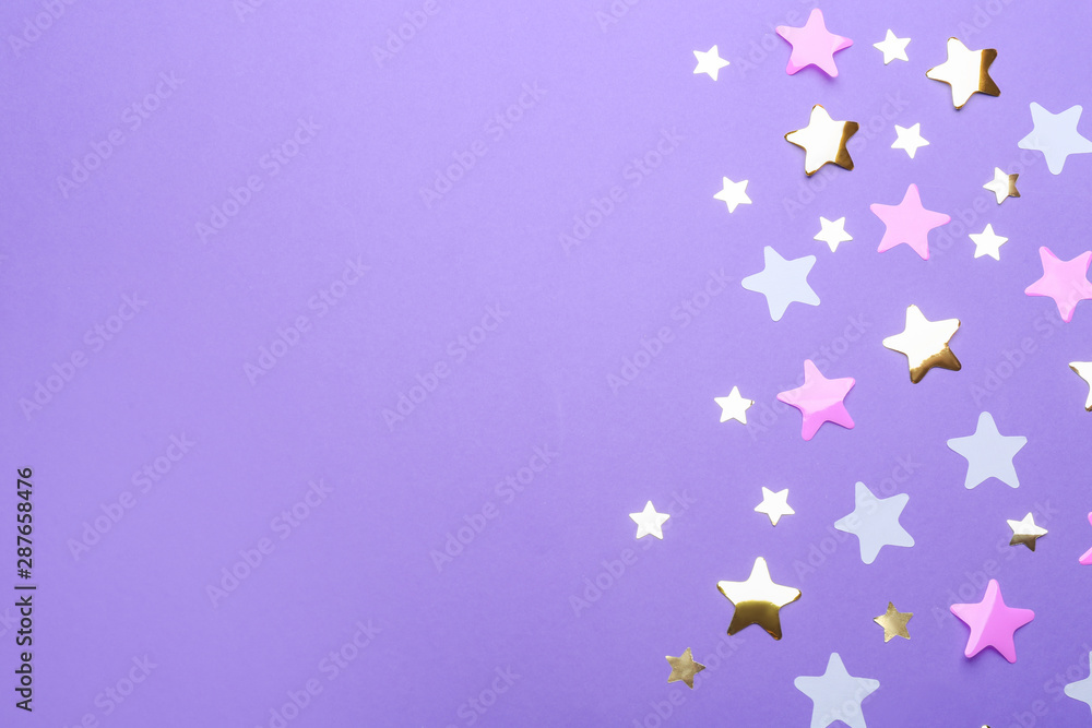 Confetti stars with space for text on violet background, top view. Christmas celebration Confetti stars with space for text on violet background, top view. Christmas celebration