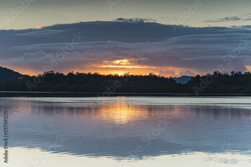 Fototapeta Naklejka Na Ścianę i Meble -  Sunrise Waterscape with Low Cloud Bank