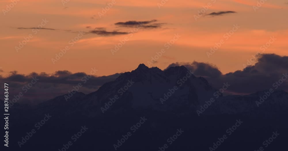4K Time Lapse of Dramatic Clouds Moving Over Mountain at Sunset 4K Time Lapse of Dramatic Clouds Moving Over Mountain at Sunset
