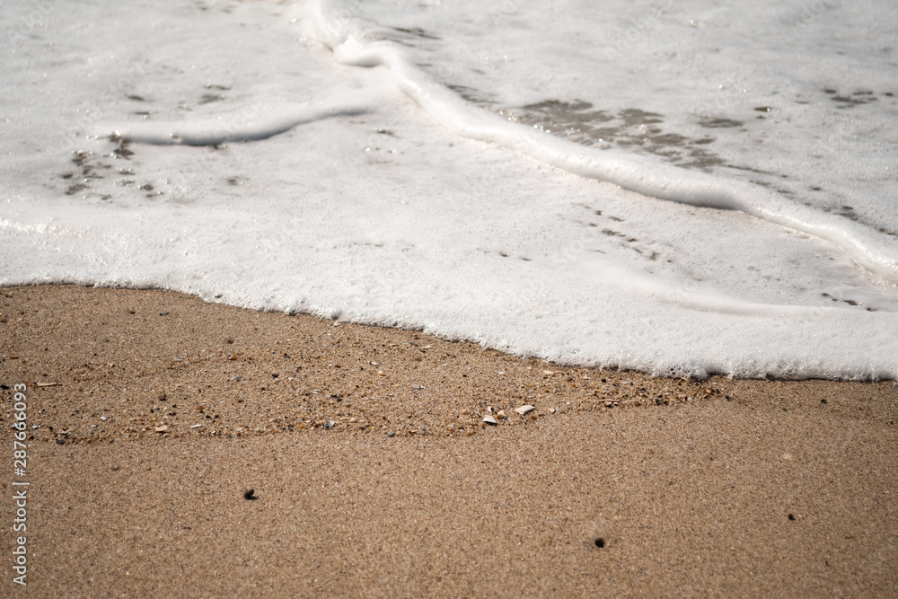 Close-up of Foamy Water Rolling into Shore Close-up of Foamy Water Rolling into Shore