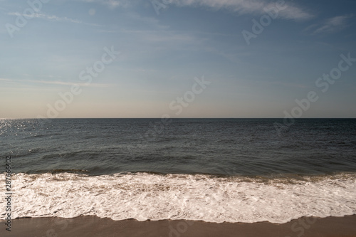 Foamy Water Flowing onto Shore at Fort Tilden, Queens, NY photo