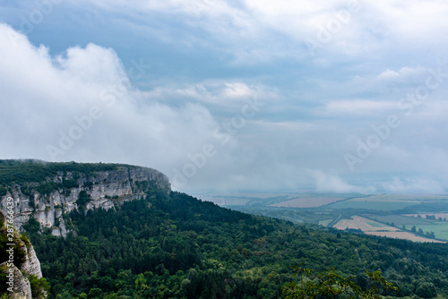 Clouds going through the mountain peak in Madara, Bulgaria