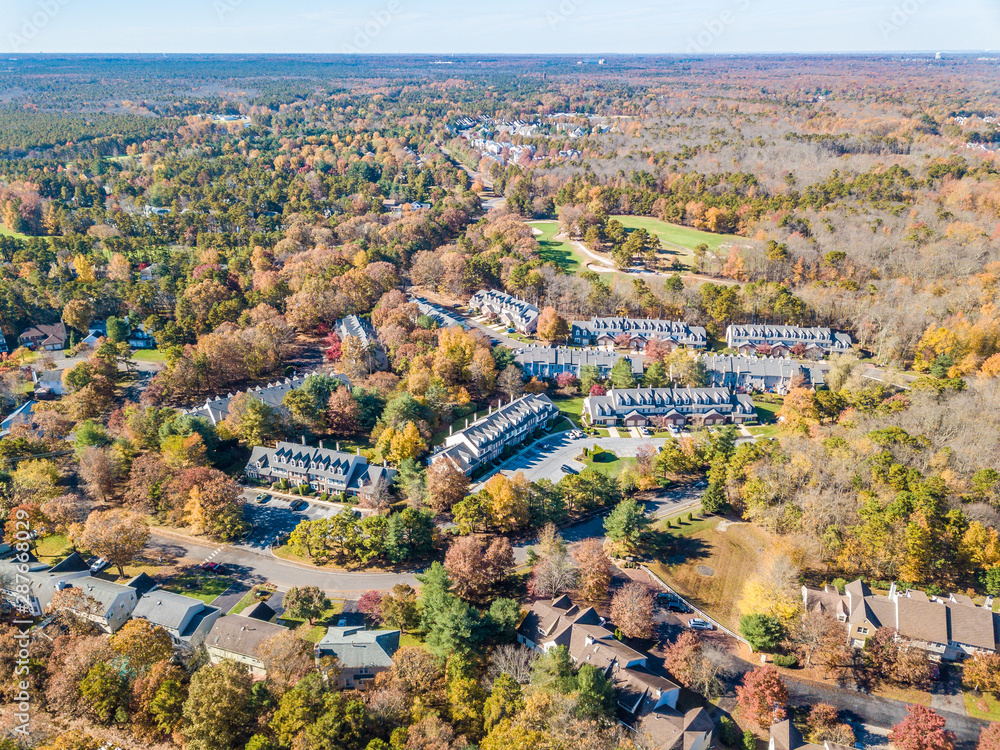 Aerial photo of rural residential community in the fall colored woods