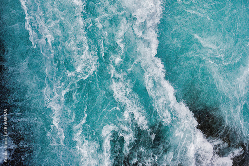 Bruarfoss waterfall in Iceland as an abstract of the blue water and whitewater from above