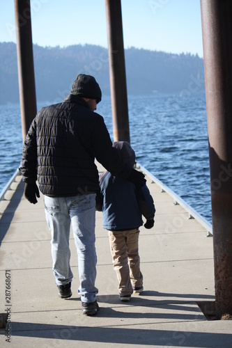 father and son on beach