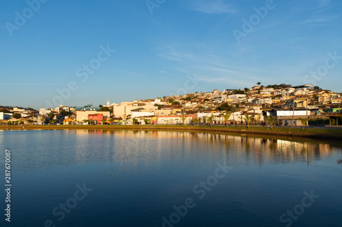 Fototapeta Naklejka Na Ścianę i Meble -  small inland town reflected in large lake, Capitólio, Minas Gerais