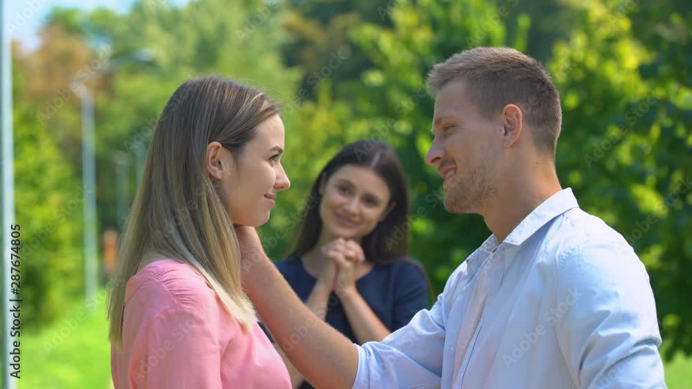 Caring woman happy her best friend finally making relationship with good man Caring woman happy her best friend finally making relationship with good man