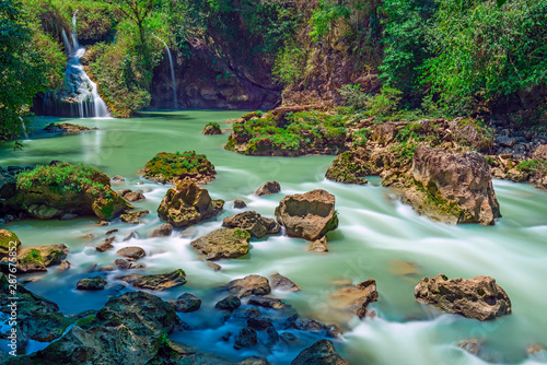 Long exposure of the limestone ridge with cascades and waterfalls of Semuc Champey, Peten jungle, Rainforest of Guatemala. photo
