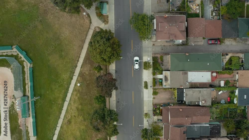 Aerial establishing shot of residential areas in a large metropolitan city. Cinematic 4K footage.