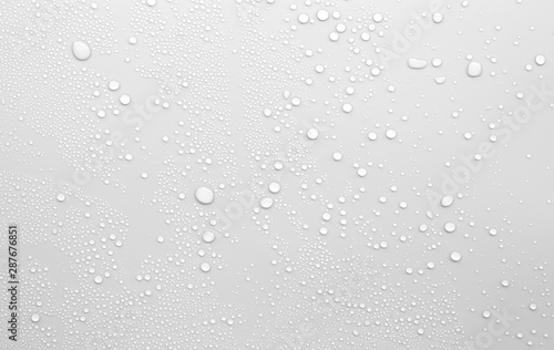 Water droplets on a gray background © treerasak