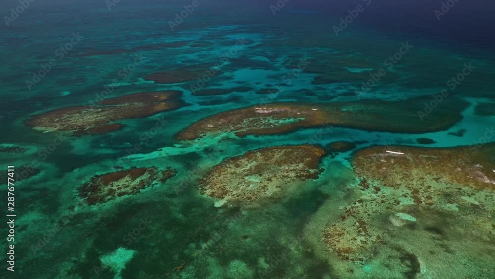 Aerial View Of Great Barrier Reef In Caribbean Ocean . Drone Parallax Shot Tilt Down 4K Aerial View Of Great Barrier Reef In Caribbean Ocean . Drone Parallax Shot Tilt Down 4K