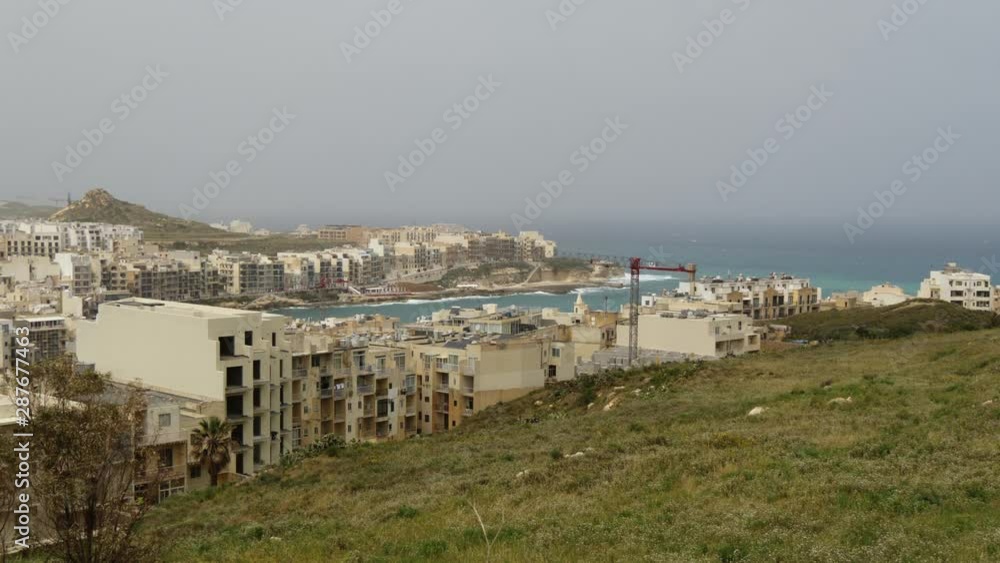 View Of Marsalforn Bay From A Hill In The Island Of Gozo, Malta View Of Marsalforn Bay From A Hill In The Island Of Gozo, Malta