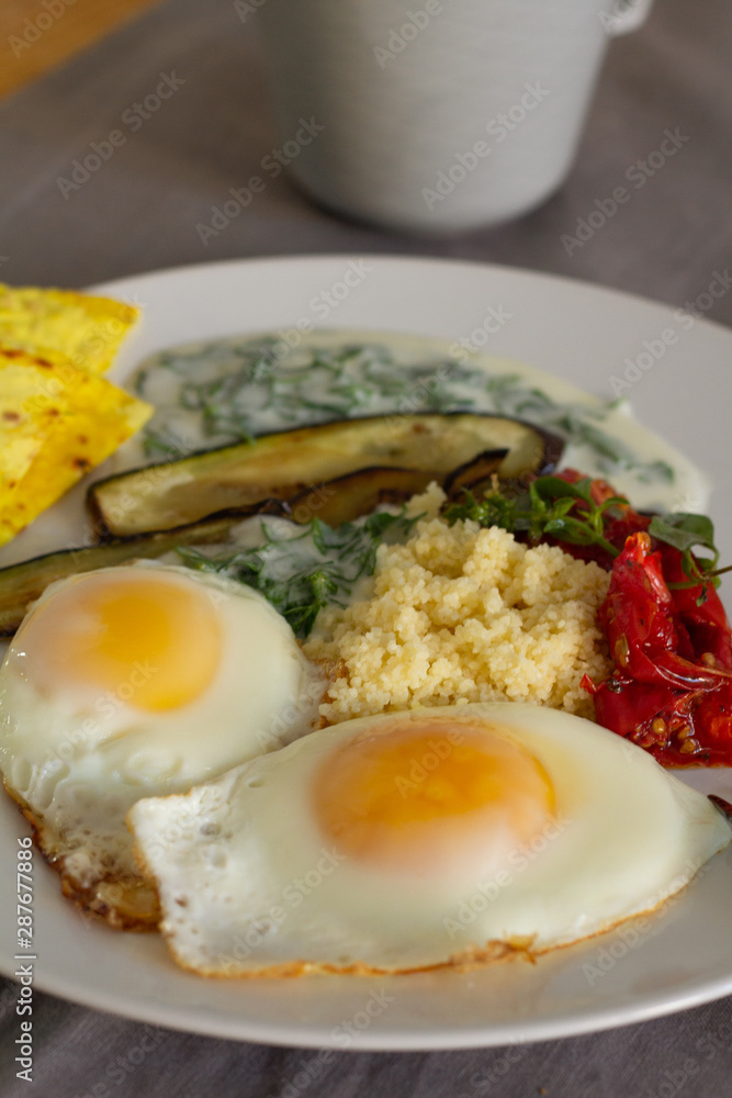 breakfast of fried eggs vegetables and yogurt breakfast of fried eggs vegetables and yogurt