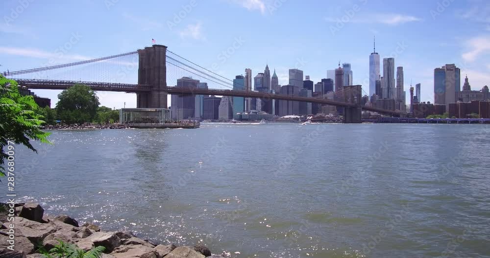 The Brooklyn Bridge over the East River between Manhattan and Brooklyn in New York. The Brooklyn Bridge over the East River between Manhattan and Brooklyn in New York.