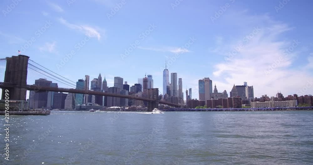 View of the skyline of Manhattan from the Main Street Park in Brooklyn, New York at daytime. View of the skyline of Manhattan from the Main Street Park in Brooklyn, New York at daytime.