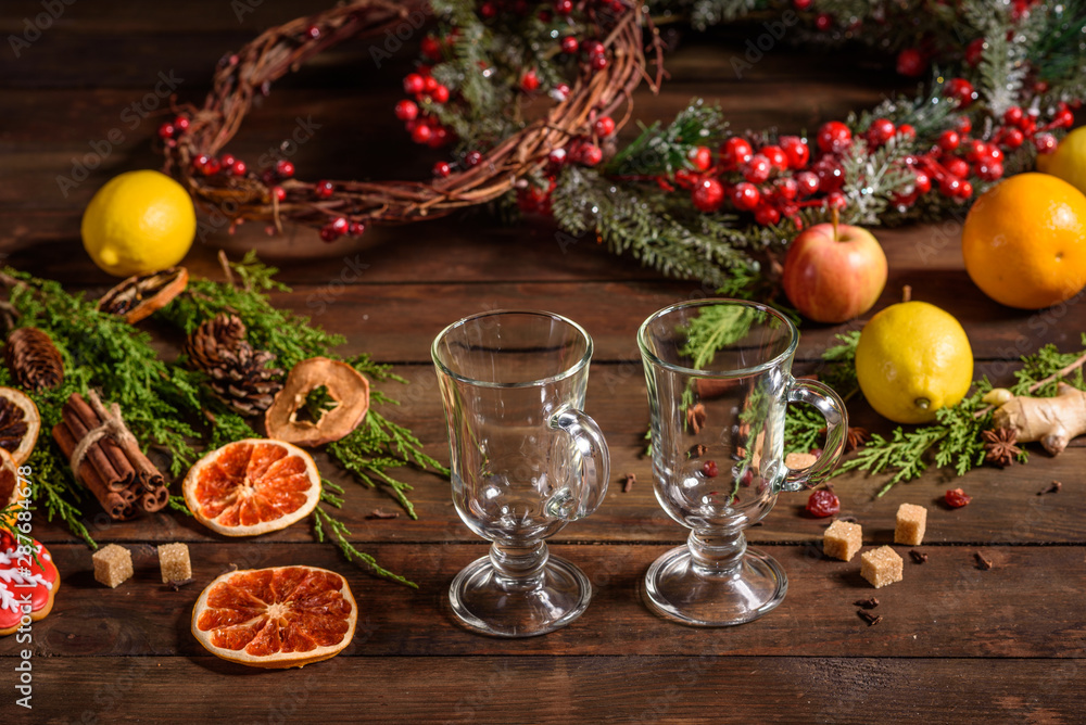 Christmas hot mulled wine with cinnamon cardamom and anise on wooden background Christmas hot mulled wine with cinnamon cardamom and anise on wooden background
