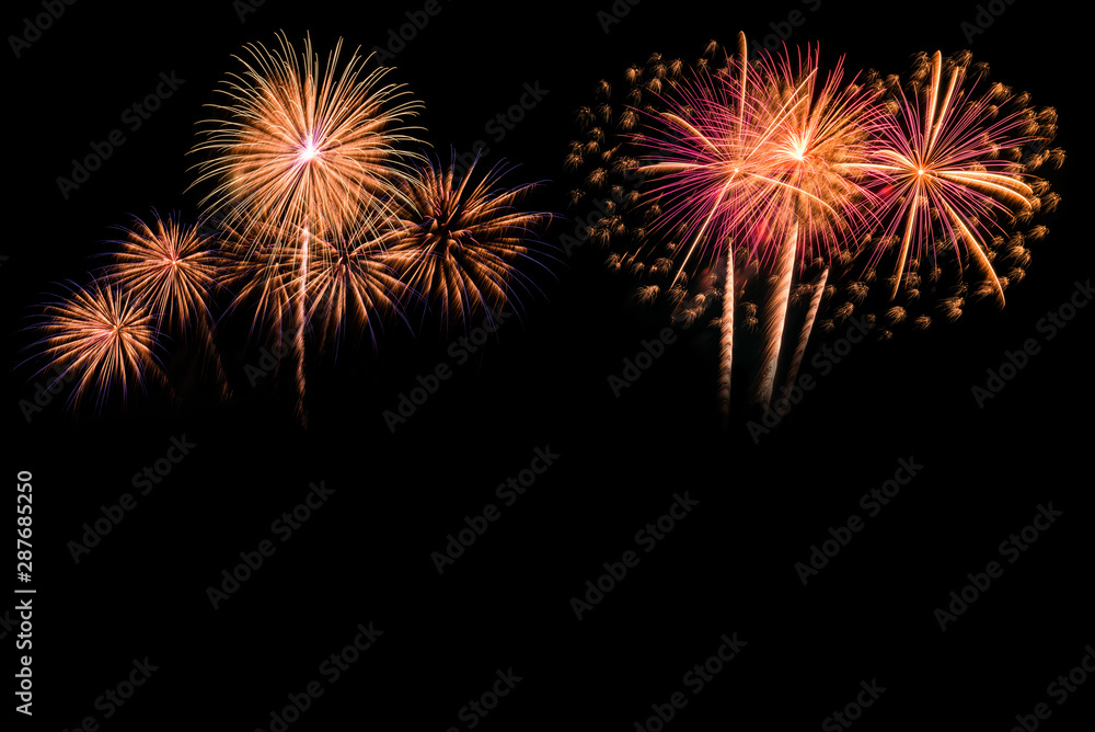 The colorful of fireworks showing on dark sky at night time for special celebration day with black background.