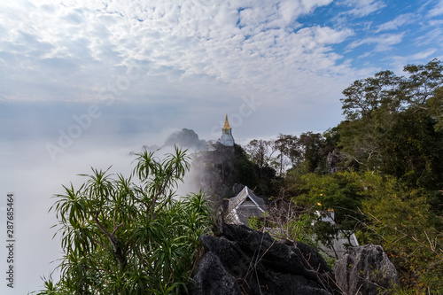 Amazing Thailand sea of mist at Wat Prajomklao Rachanusorn (Wat Phrabat Pu Pha Daeng) , Lampang province, Thailand photo