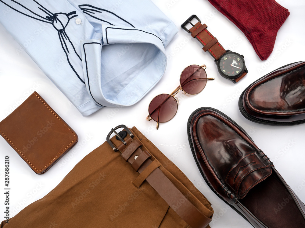 Creative fashion design for men casual clothing set isolated on white  background include brown loafer shoes, yellow pants, blue shirt, watch,  sunglasses, red sock and belt. top view Stock Photo | Adobe