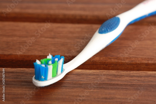 blue and green white toothbrush