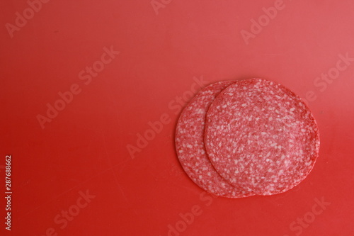 slices of salami in colorful background