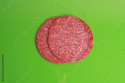 slices of salami in colorful background