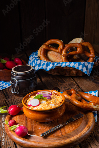 rustic Bavarian obazda with radishes and onions photo