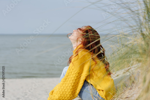фотографія Happy young woman giggling to herself